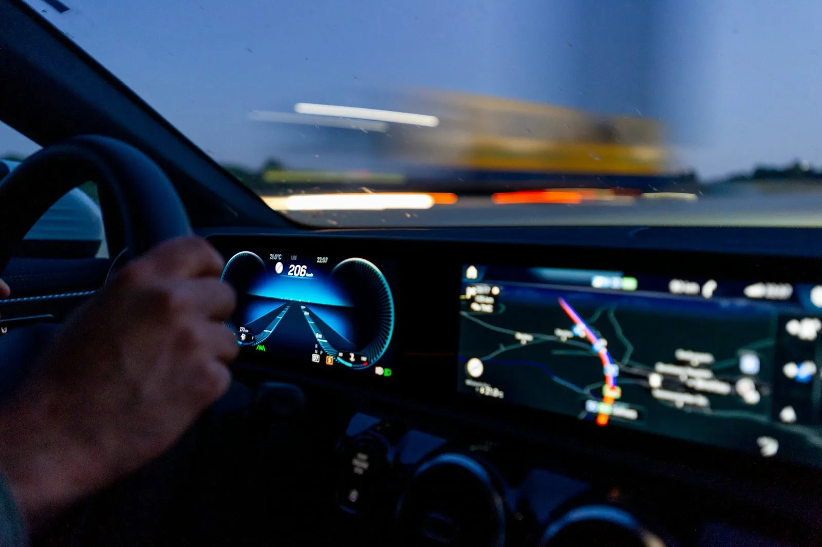 person’s hand on steering wheel