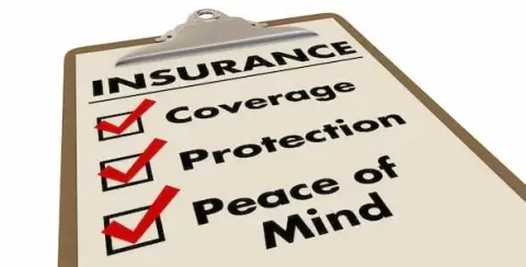 A clipboard showcasing an "Insurance" checklist: Coverage, Protection, Peace of Mind—each ticked with a red check. It's a clear reminder of how auto insurance policies stack up to provide comprehensive security and assurance.