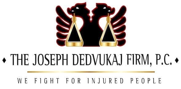 The logo of The Joseph Dedvukaj Firm, P.C. showcases two red-winged lions facing a scale above the text "We Fight for Injured People," symbolizing their dedication as an Albanian American personal injury firm.
