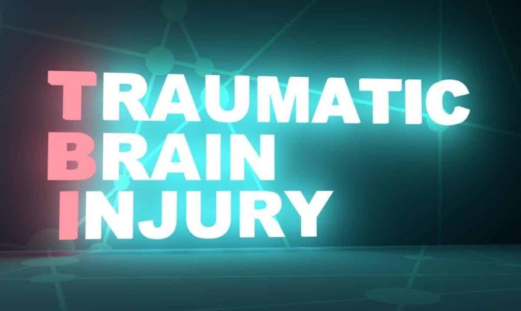 Glowing text reads "TRAUMATIC BRAIN INJURY," with the initials "TBI" highlighted vertically against a dark backdrop, symbolizing the journey toward resolving my TBI claim and reaching maximum medical improvement.